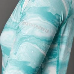 2022 Weatherbeeta Womens Ruby Printed Long Sleeve Top 1009342023 - Turquoise Swirl -Equestrian Products Store 4511 1009342000 TURQUOISESWIRLMARBLEPRINT WB Ruby LS CU2 Image Null Hero.700x700